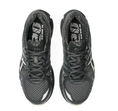 a pair of black and white running shoes