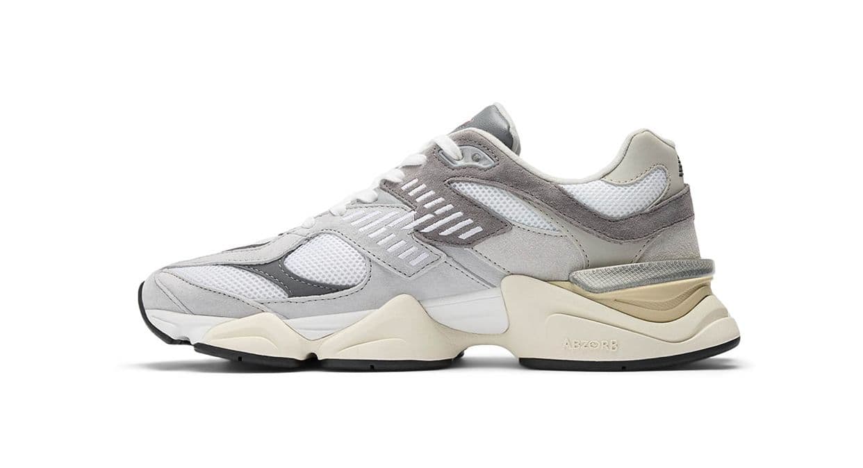 a white and grey sneaker on a white background