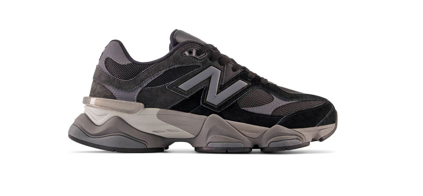 a black and grey sneaker on a white background