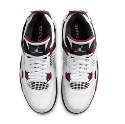 a pair of white and red sneakers on a white background