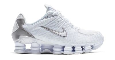 a white nike air vapor running shoe