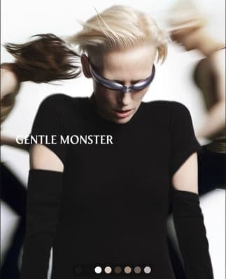 a woman in a black dress and sunglasses