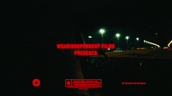 a car driving down a street at night