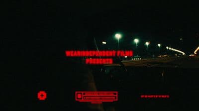 a car driving down a street at night