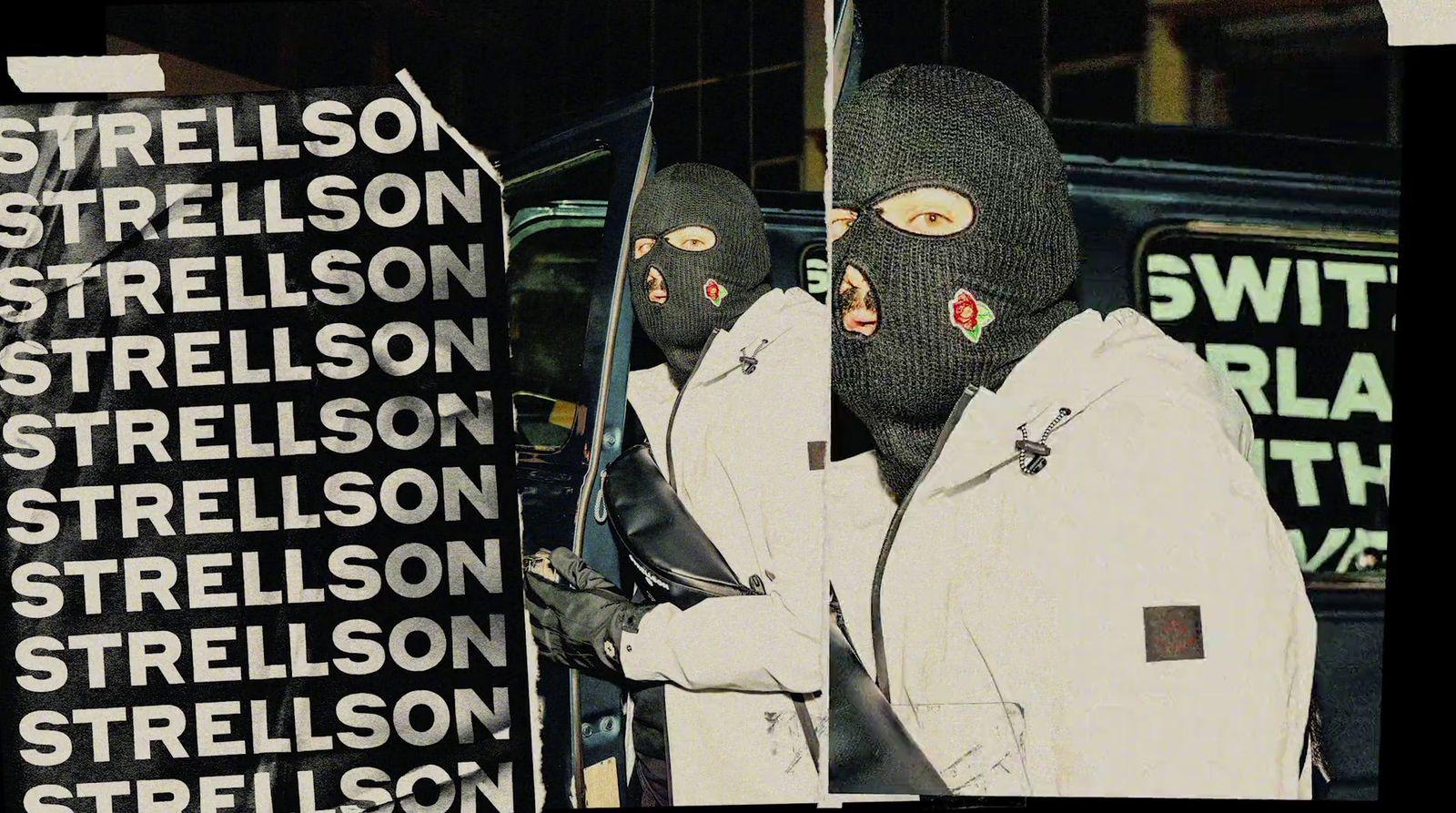 a person wearing a ski mask and holding a pair of skis
