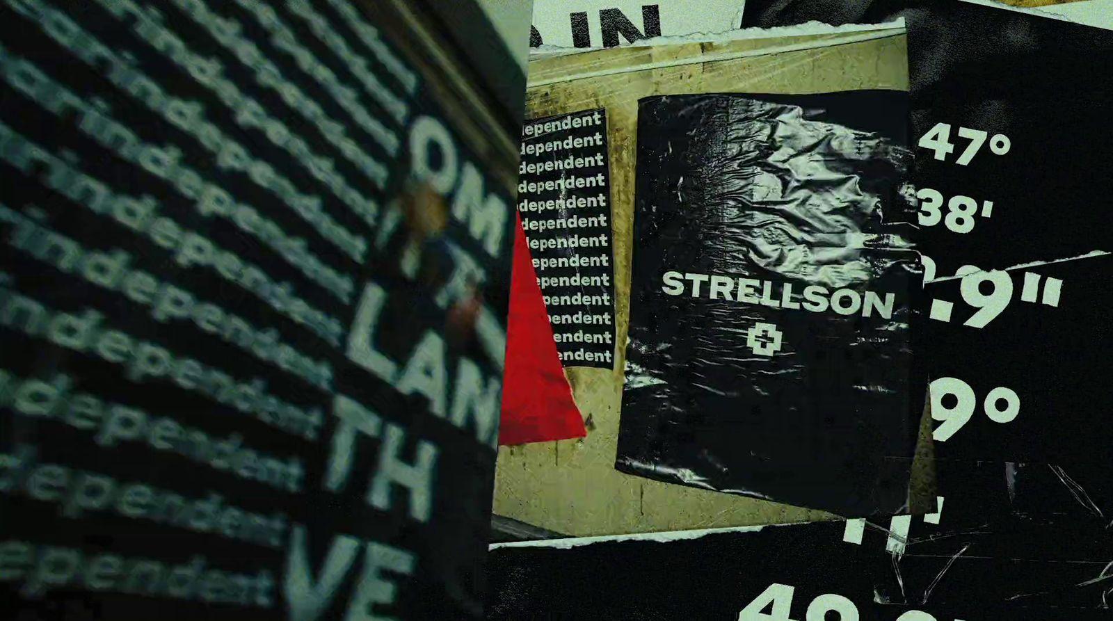 a pile of black and white posters on a wall