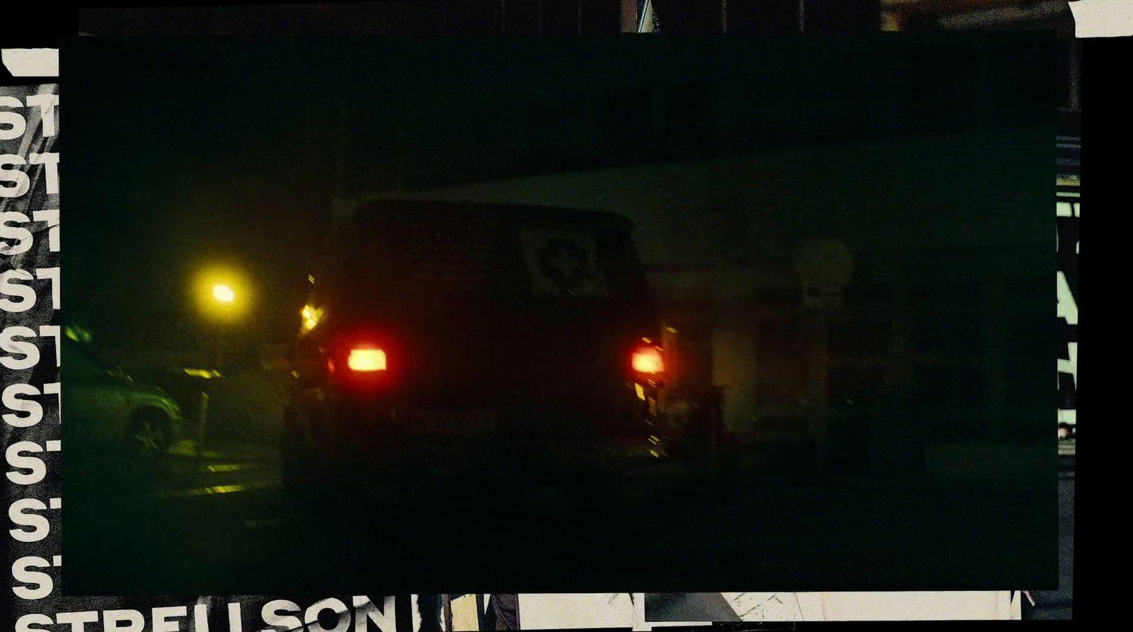 a car that is sitting in the street at night