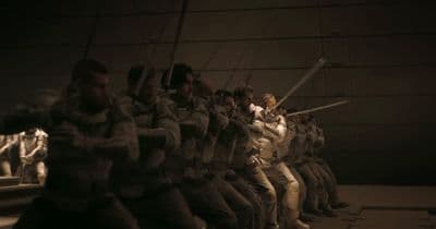 a group of soldiers are lined up in a row