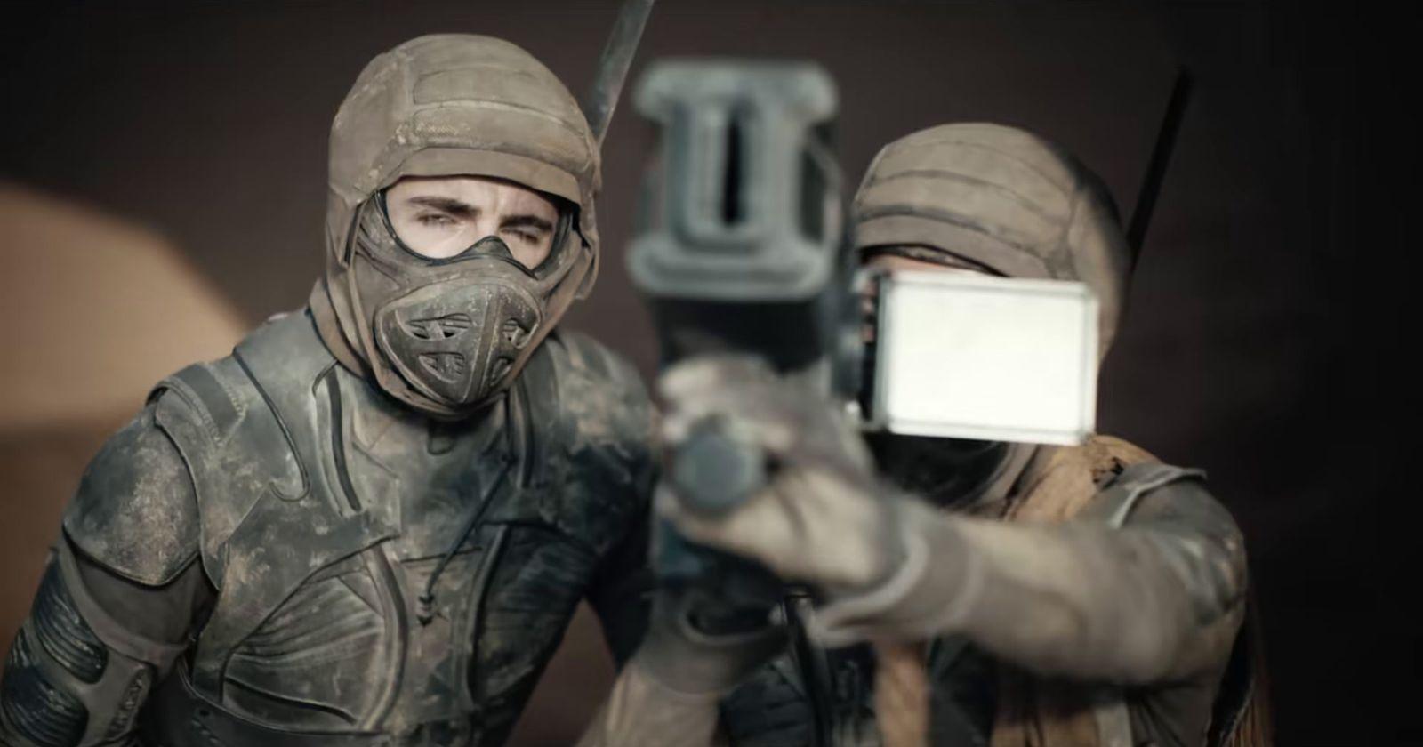 a couple of people that are holding a cell phone