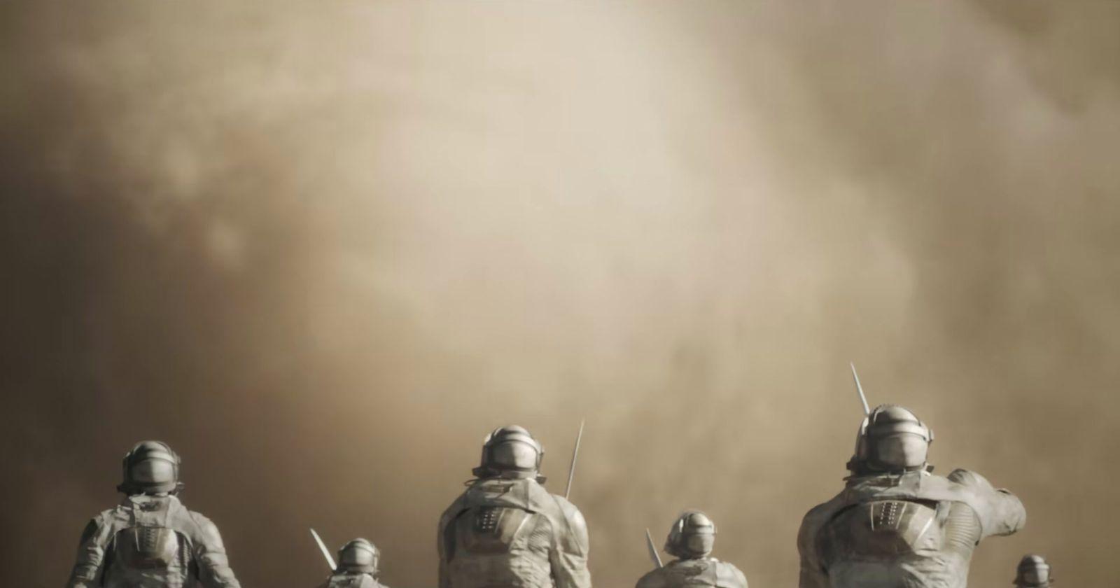 a group of people standing in front of a dust storm