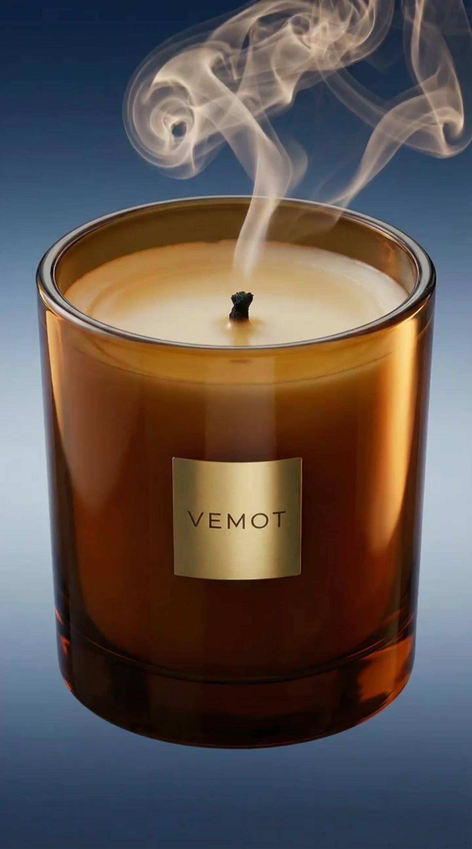 a candle with smoke coming out of it