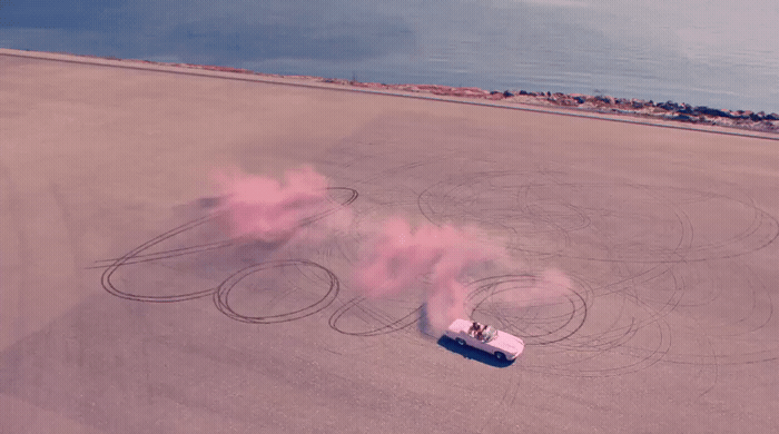 an aerial view of a car with smoke coming out of it