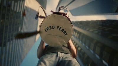 a person holding a piece of paper with the word feed penny on it