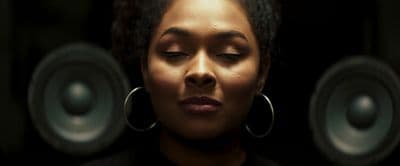 a woman with her eyes closed and her eyes closed