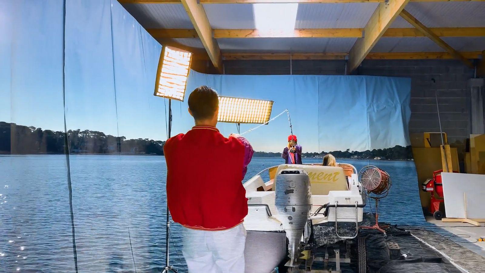 a man standing on a boat in the water