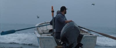 a man in a boat on the water