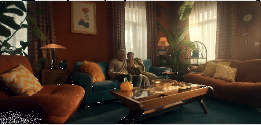 a man sitting on a couch in a living room