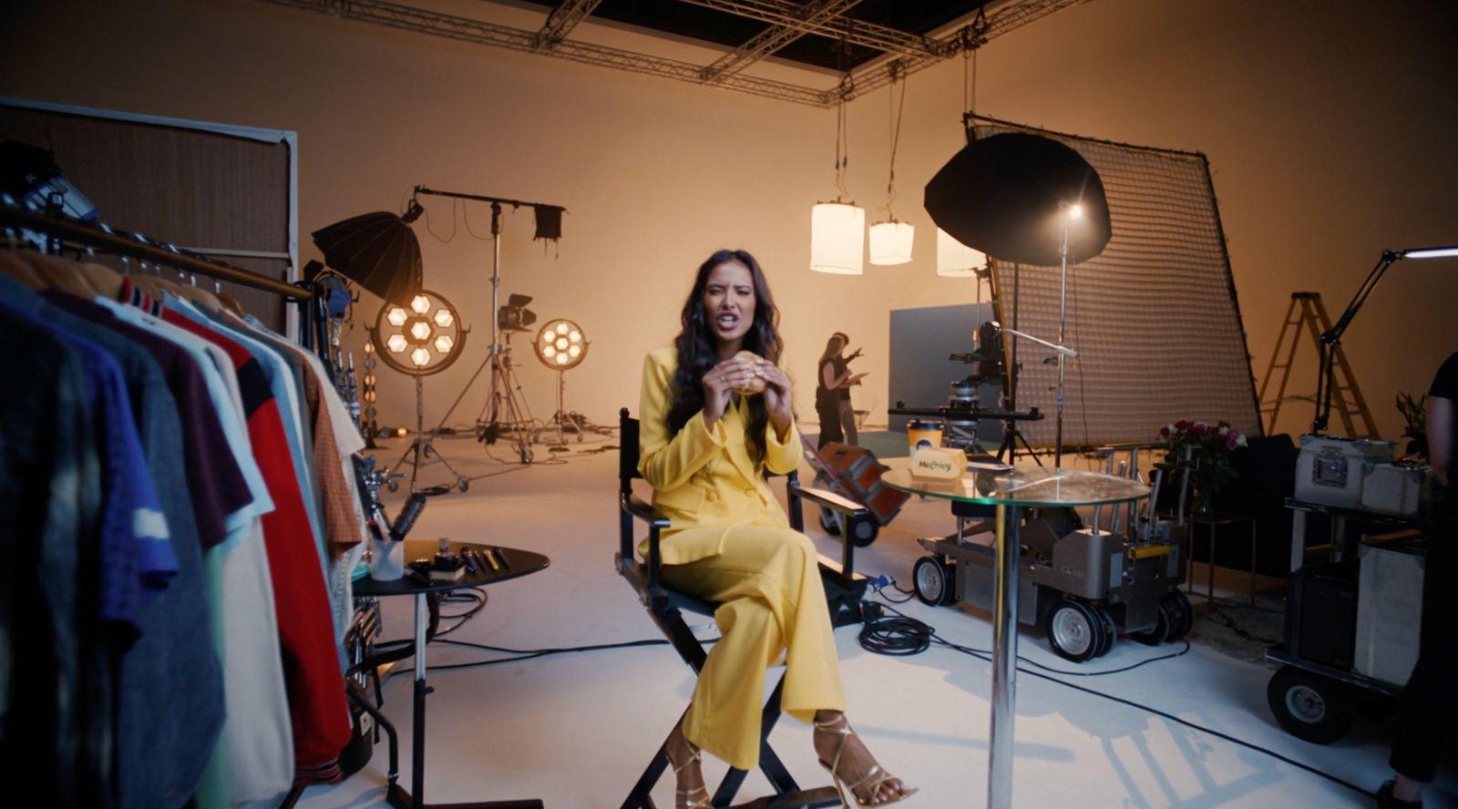 a woman sitting in a chair in a room