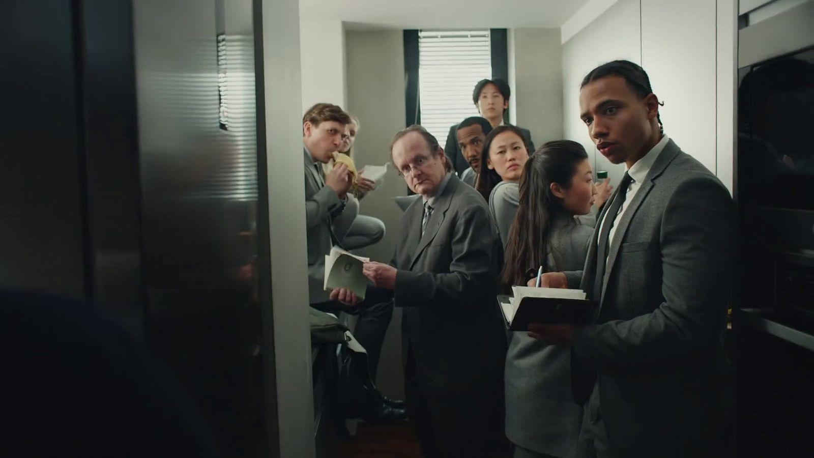 a group of people standing in a room