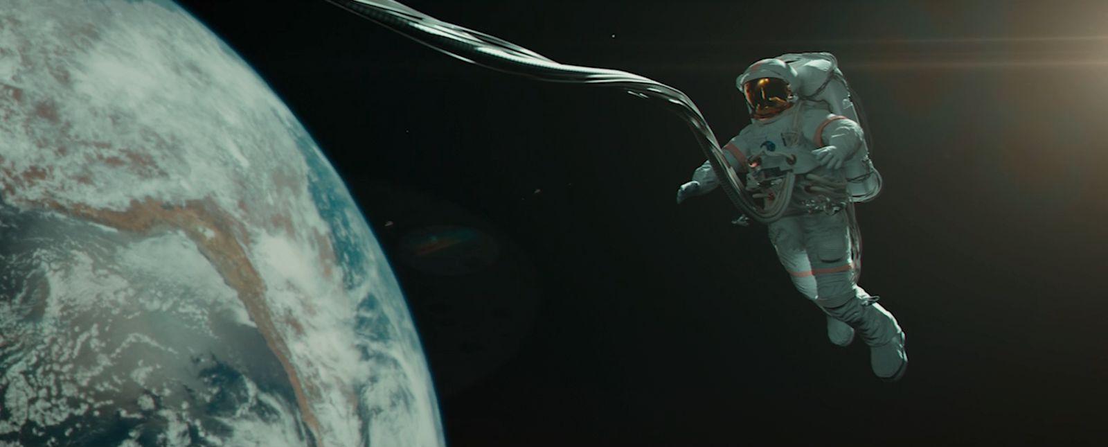 an astronaut floating in space next to the earth