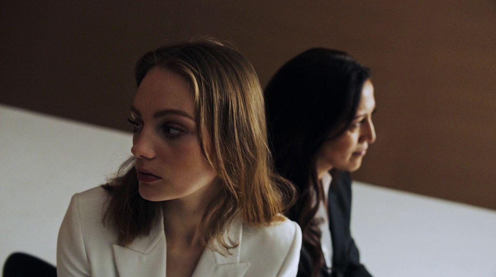 a couple of women sitting next to each other