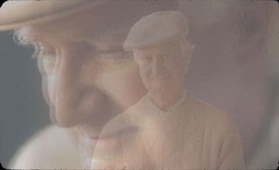 a man with a hat and a white shirt