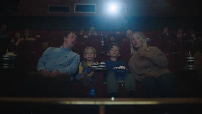 a group of people sitting in a movie theater