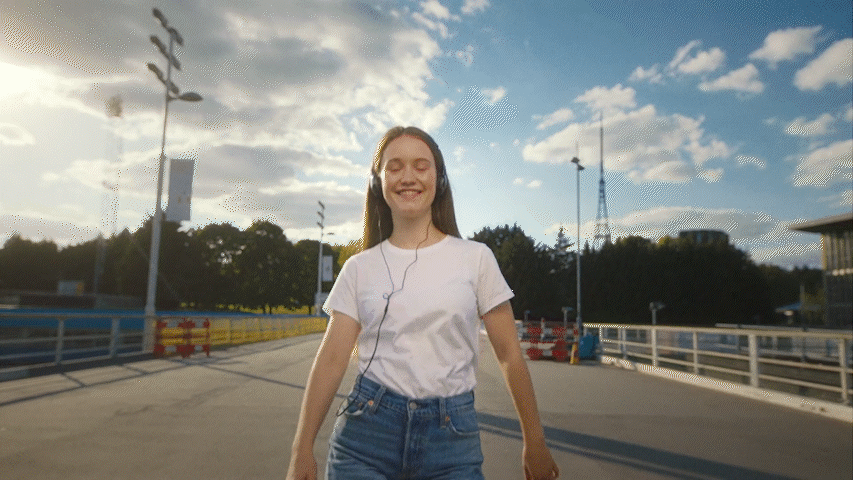 a woman in a white shirt is skateboarding