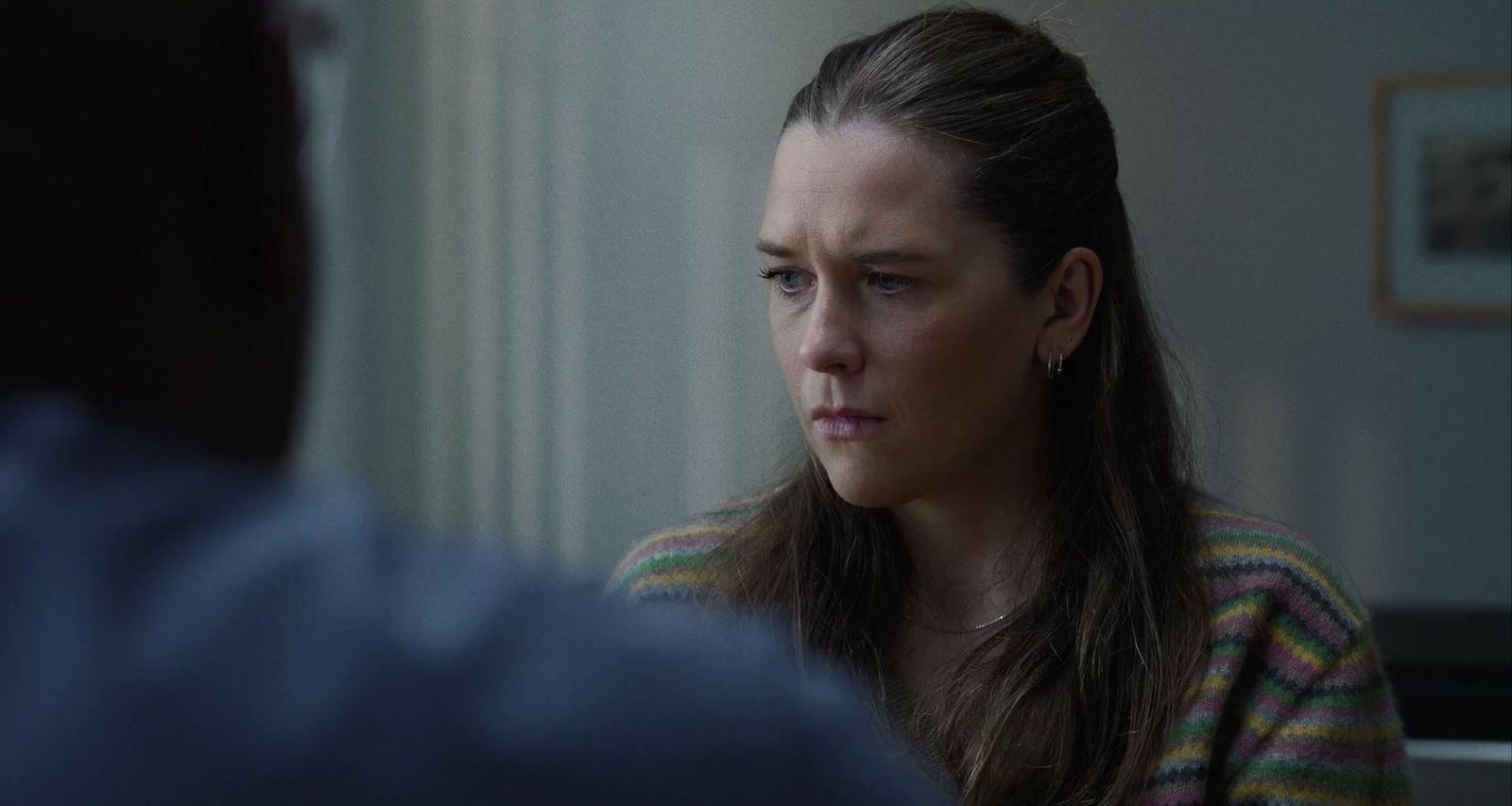 a woman with a concerned look on her face
