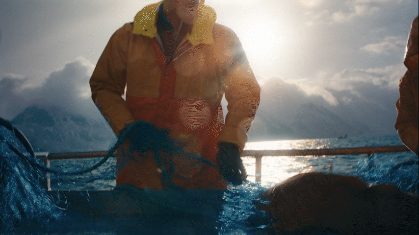 a man standing on a boat in the water
