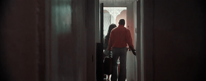 a man and a woman standing in a doorway