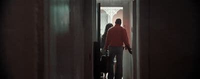 a man and a woman standing in a doorway