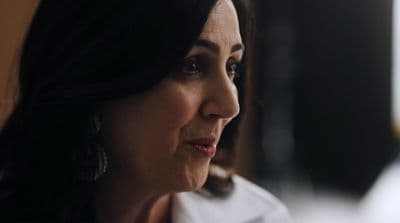 a close up of a person wearing earrings