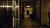 a long hallway leading to an office building
