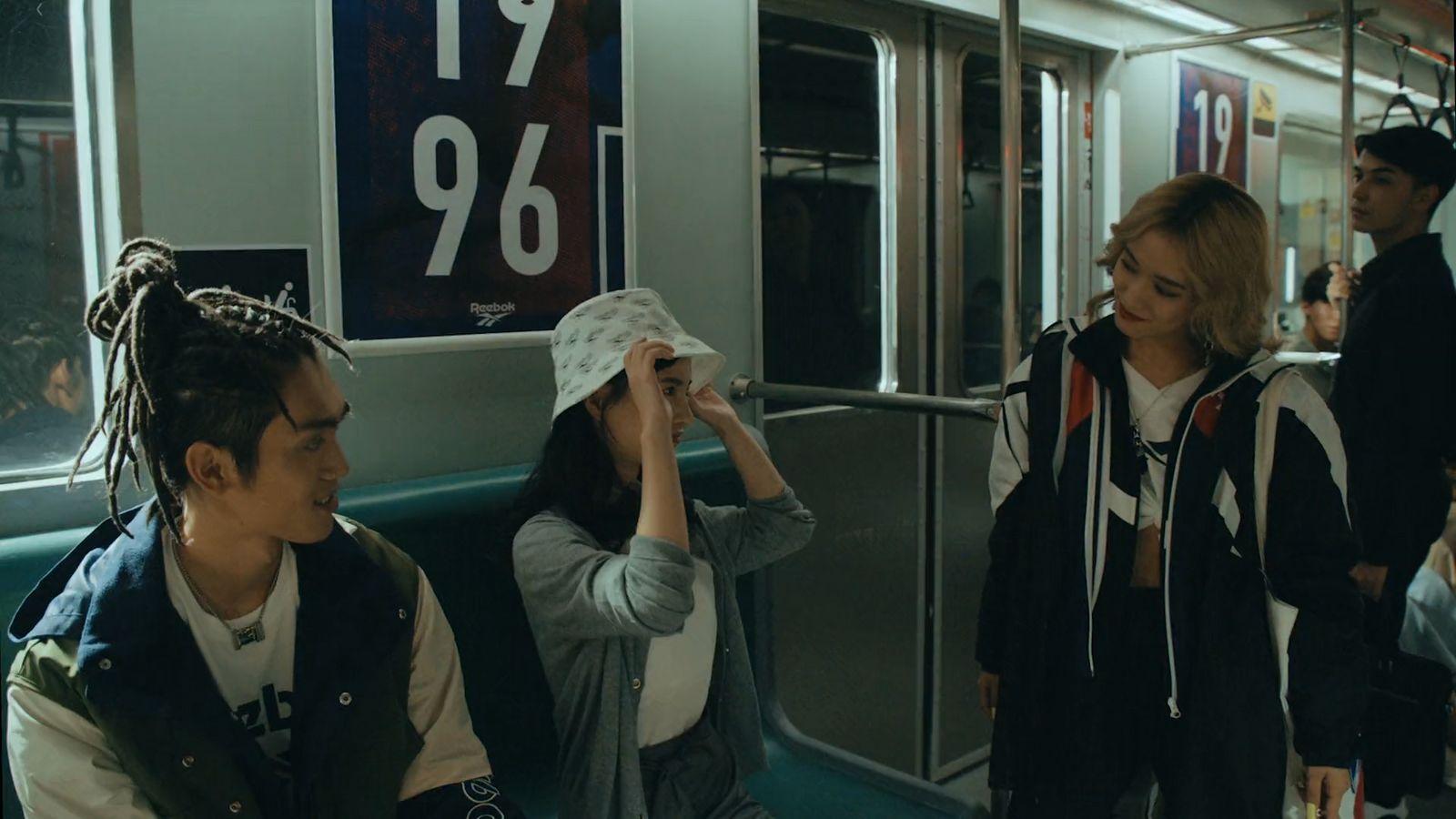 a group of people riding on a subway train