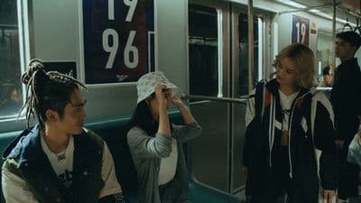 a group of people riding on a subway train