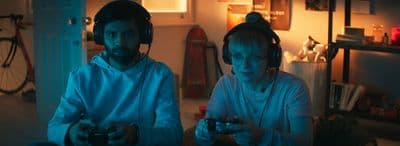 a man and a woman playing a video game