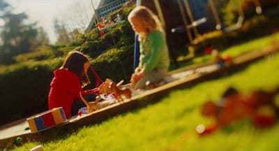 a group of children playing in a park