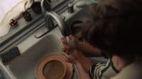 a person washing their hands in a sink