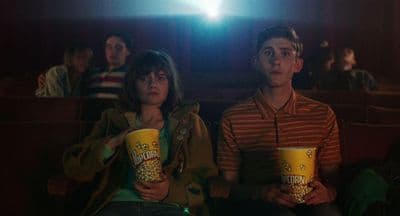 a man and a woman sitting next to each other