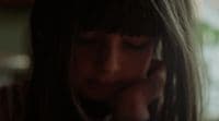 a close up of a person talking on a cell phone