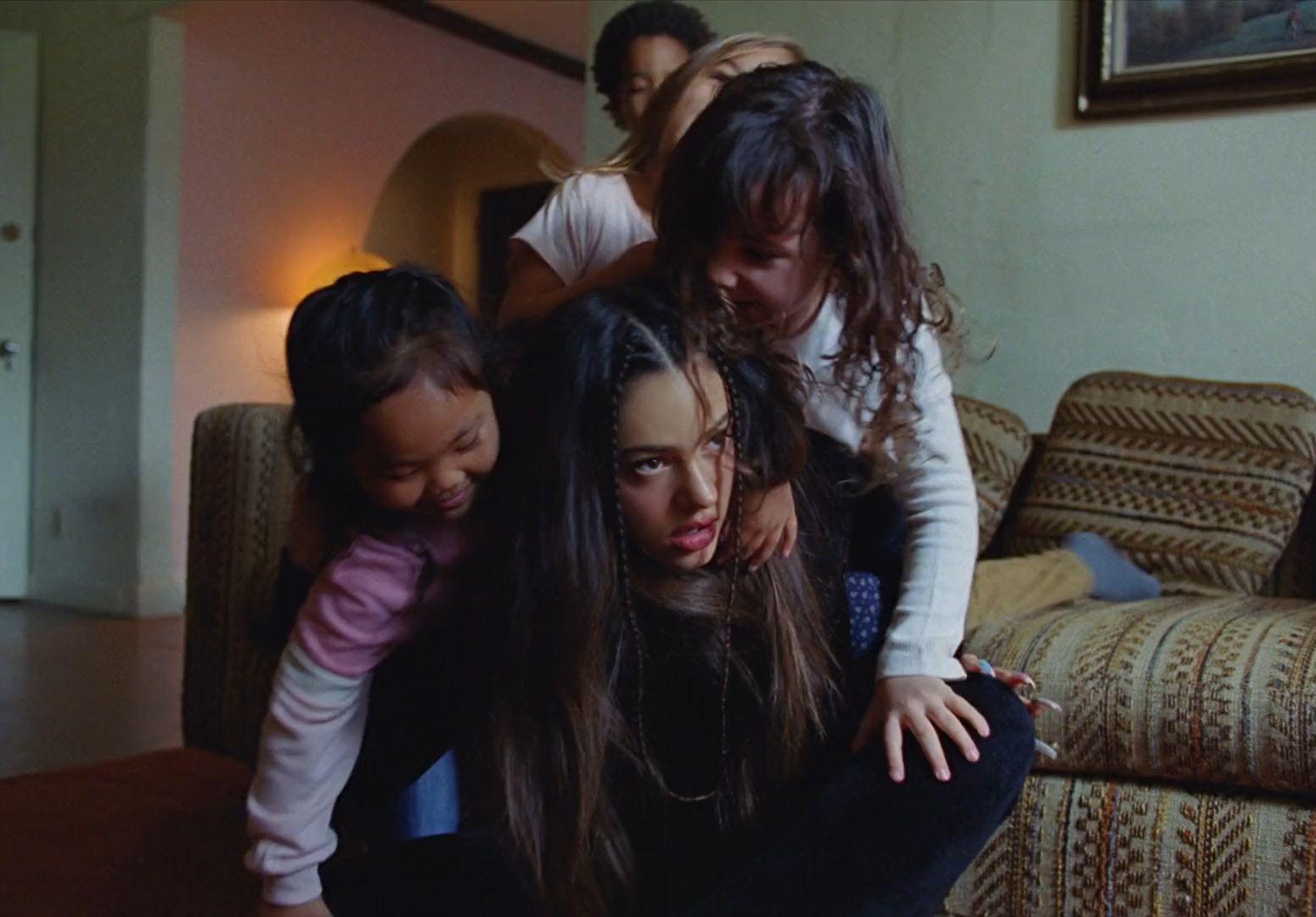 a group of people sitting on top of a couch
