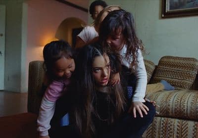 a group of people sitting on top of a couch