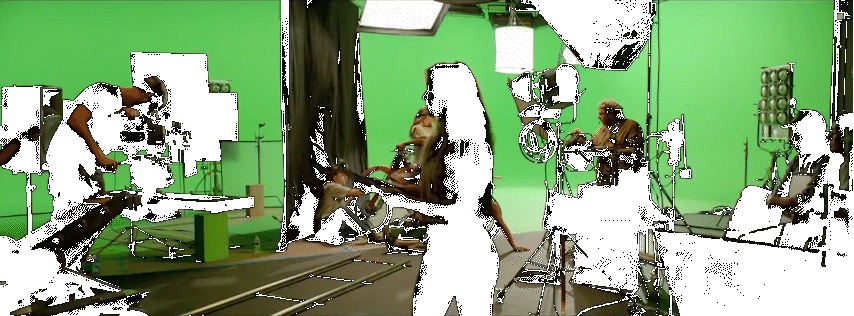 a group of people in a green screen studio