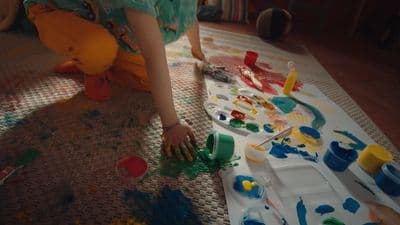 a young child is playing with toys on the floor