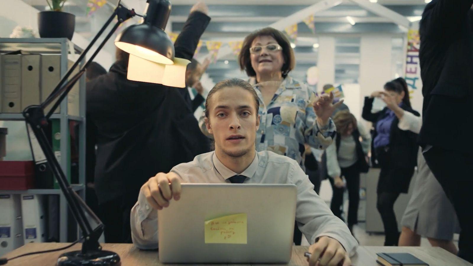 a man sitting in front of a laptop computer