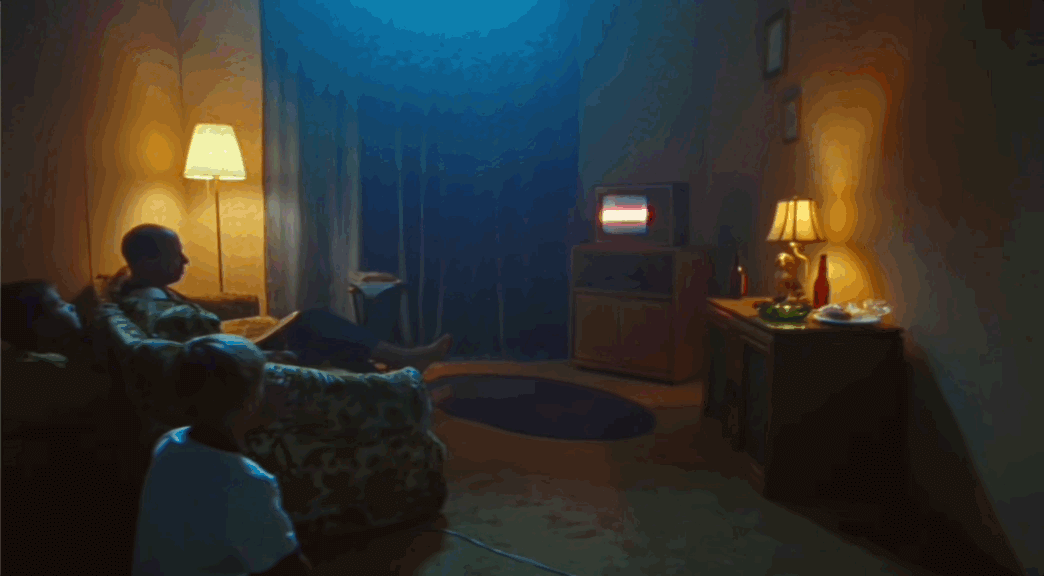 a man sitting on a couch in a living room