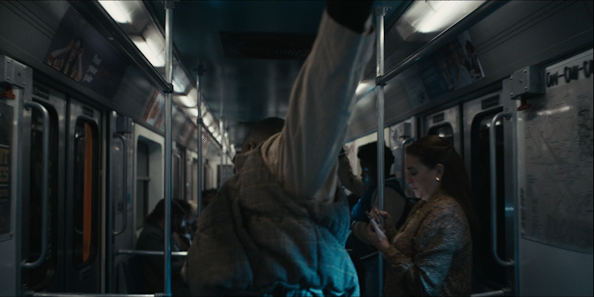 a group of people riding on a subway train