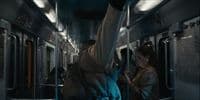 a group of people riding on a subway train