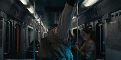 a group of people riding on a subway train